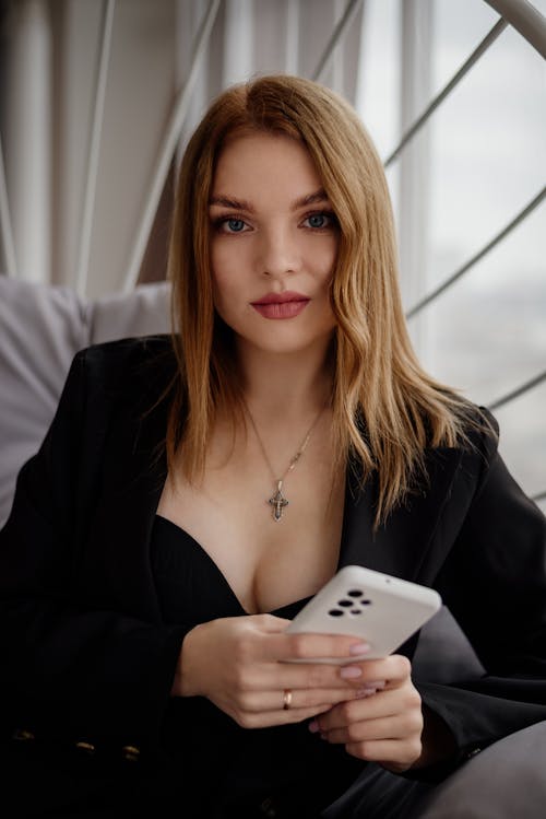Portrait of Blonde Woman with Smartphone