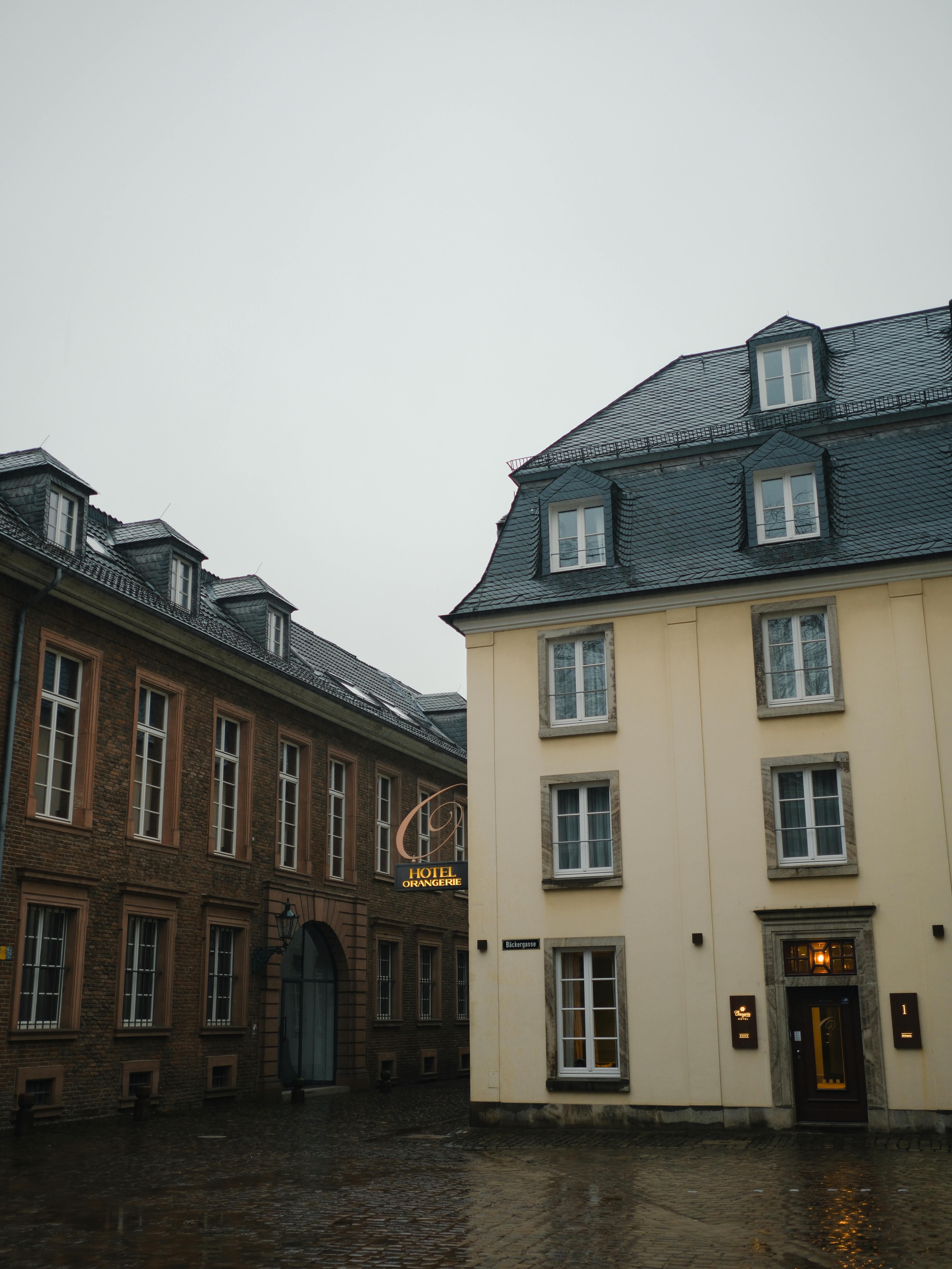 Discover the charm of Düsseldorf architecture with classic buildings in a serene street view.