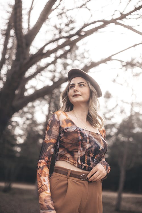 Model in Brown Beret and Patterned Blouse in the Park