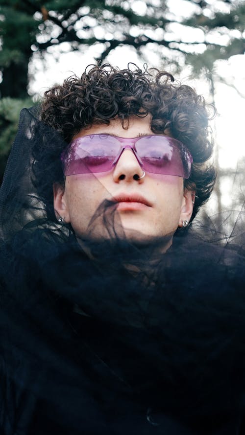 Portrait of Man in Purple Sunglasses