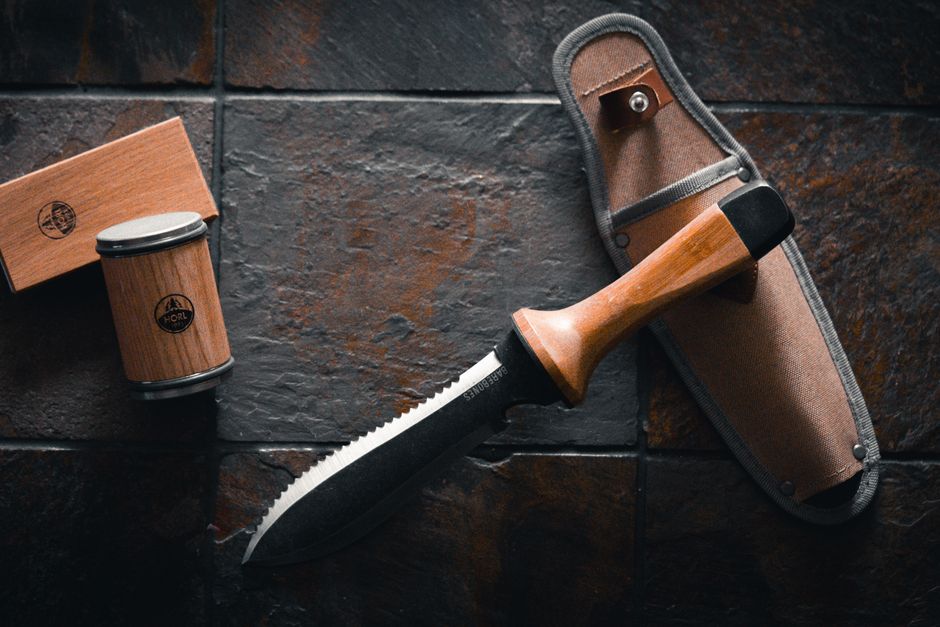 Rolling sharpener beside a hori hori garden tool — tools for sharpening hedge clippers and garden blades in Surrey BC