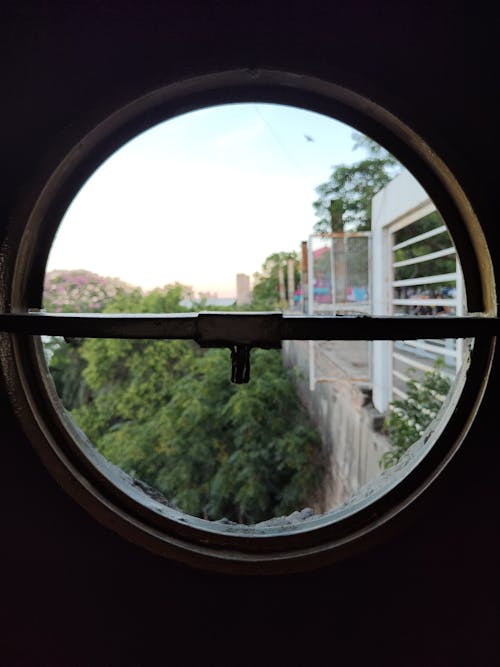 Free stock photo of airplane window, arched window, circle