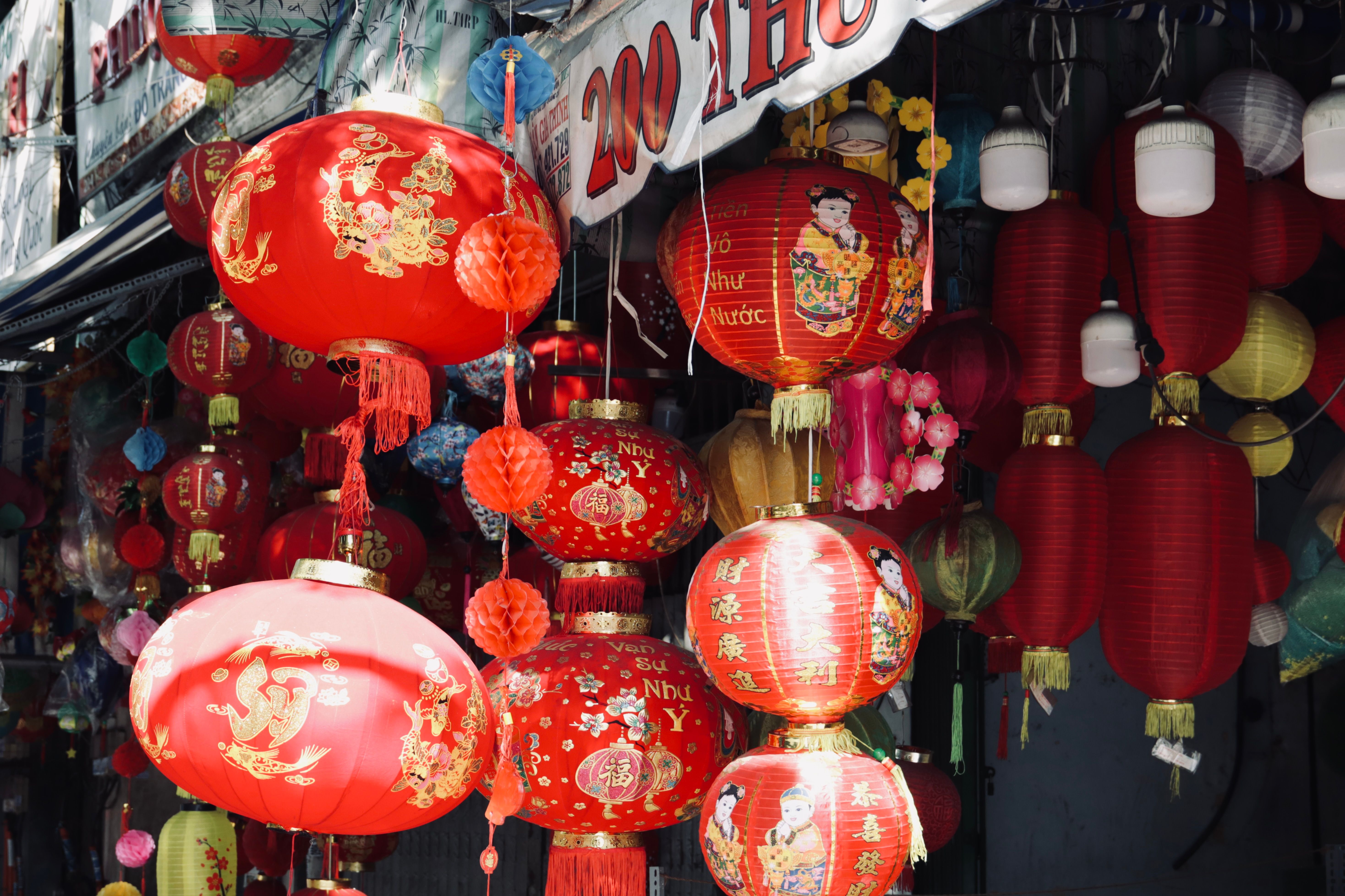 Market stall lit by warm lanterns at night
