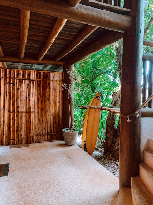 A wooden door with a surfboard on it