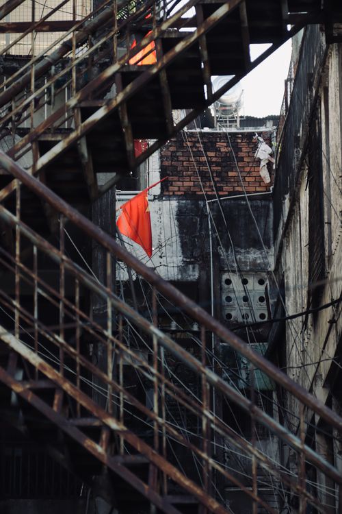 Free A close-up of a rusty staircase in an urban setting, highlighting the aged architecture and decay. Stock Photo