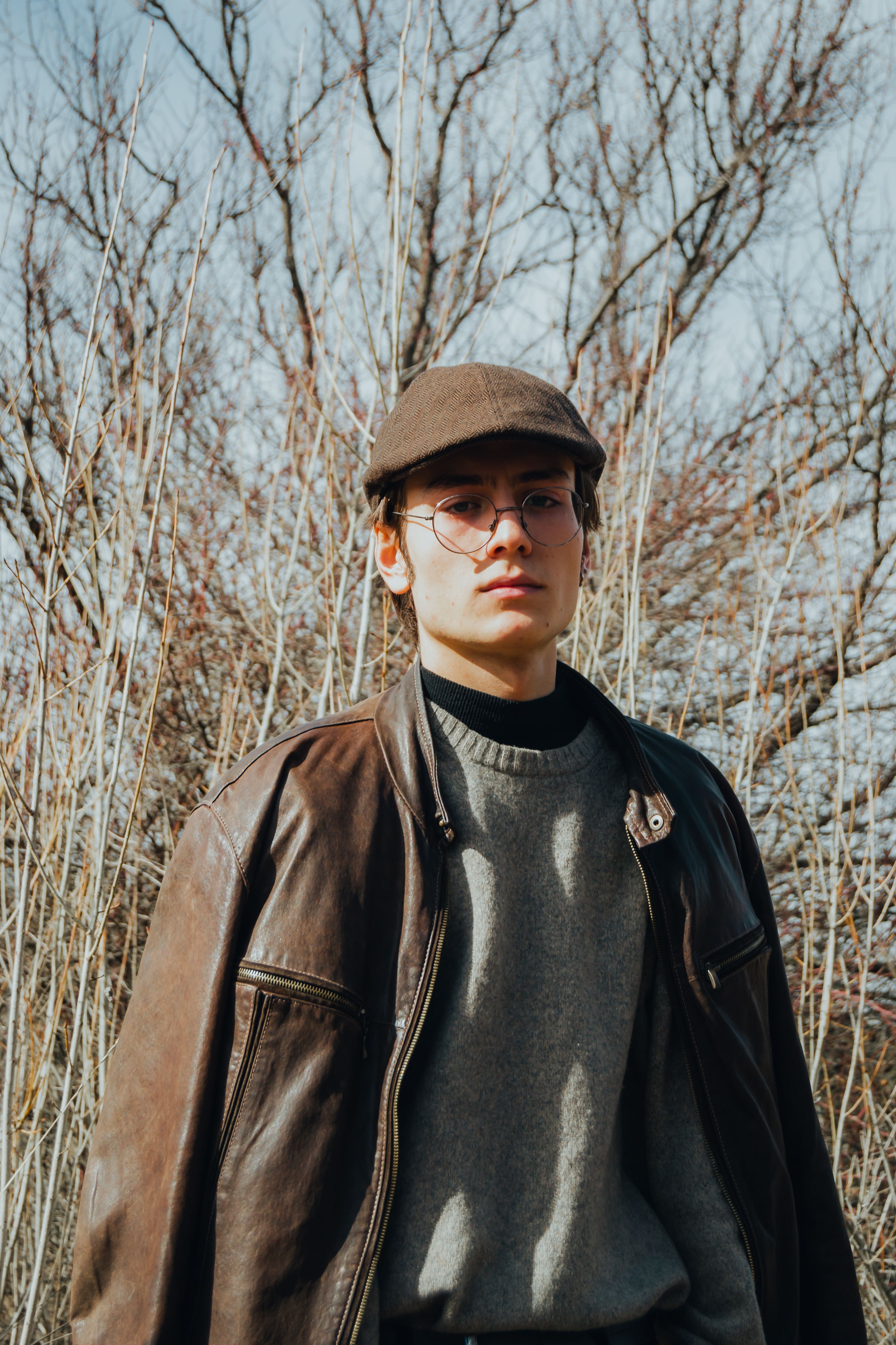Portrait of a Young Man Wearing a Brown Jacket and a Flat Cap · Free ...