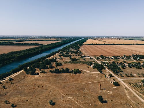 An aerial view of a field and river