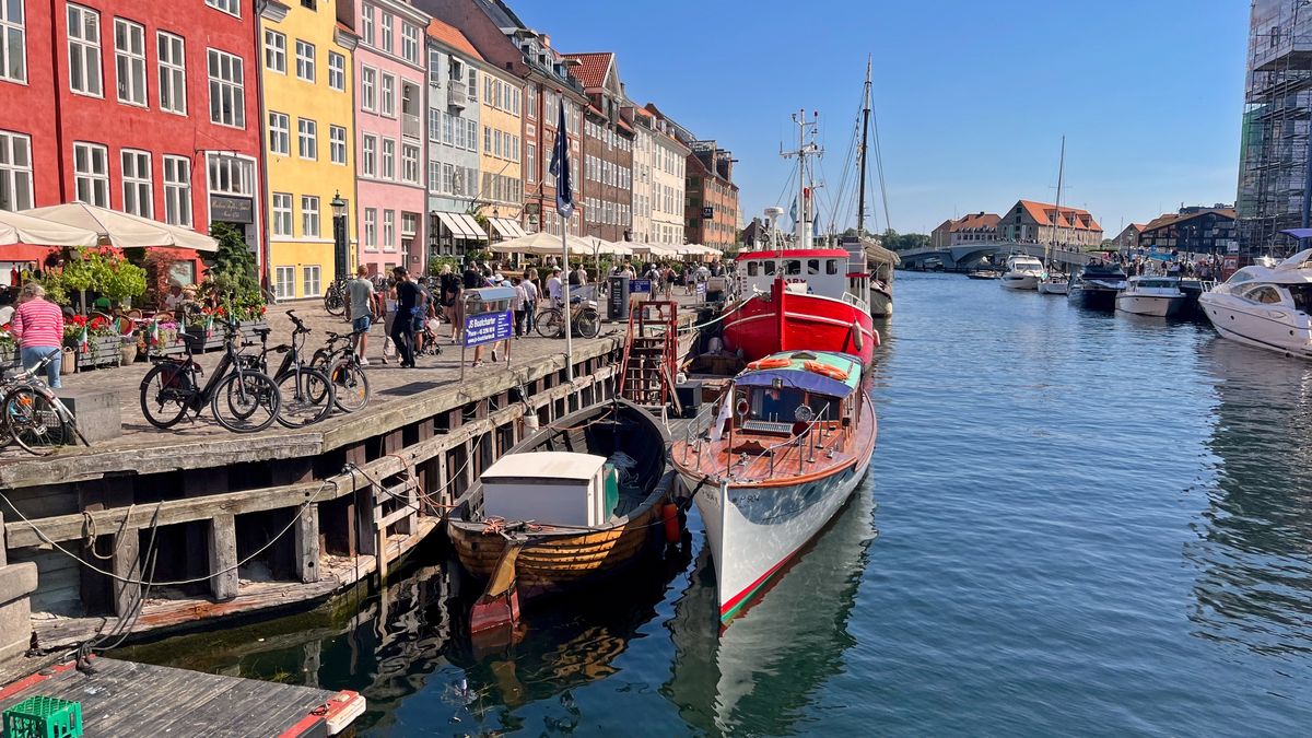 Colorful townhouses and boats along the Nyhavn canal in Copenhagen, Denmark