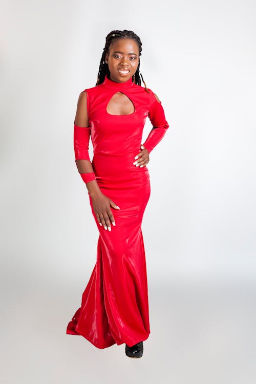 A woman in a red dress posing for a photo