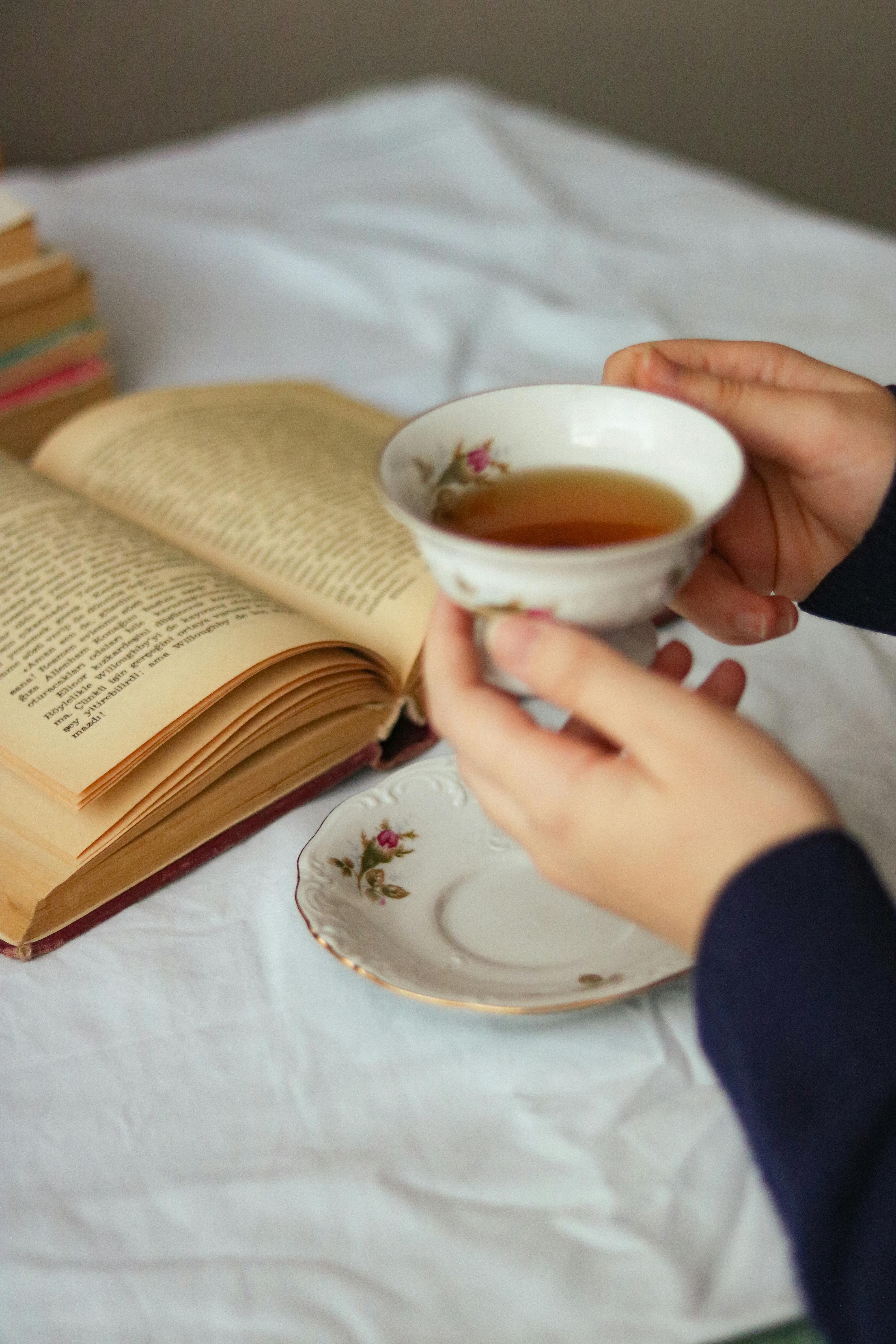 Enjoy a relaxing moment with a cup of tea and a good book indoors.