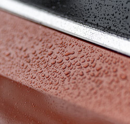 Close-up of Water Droplets on a Car