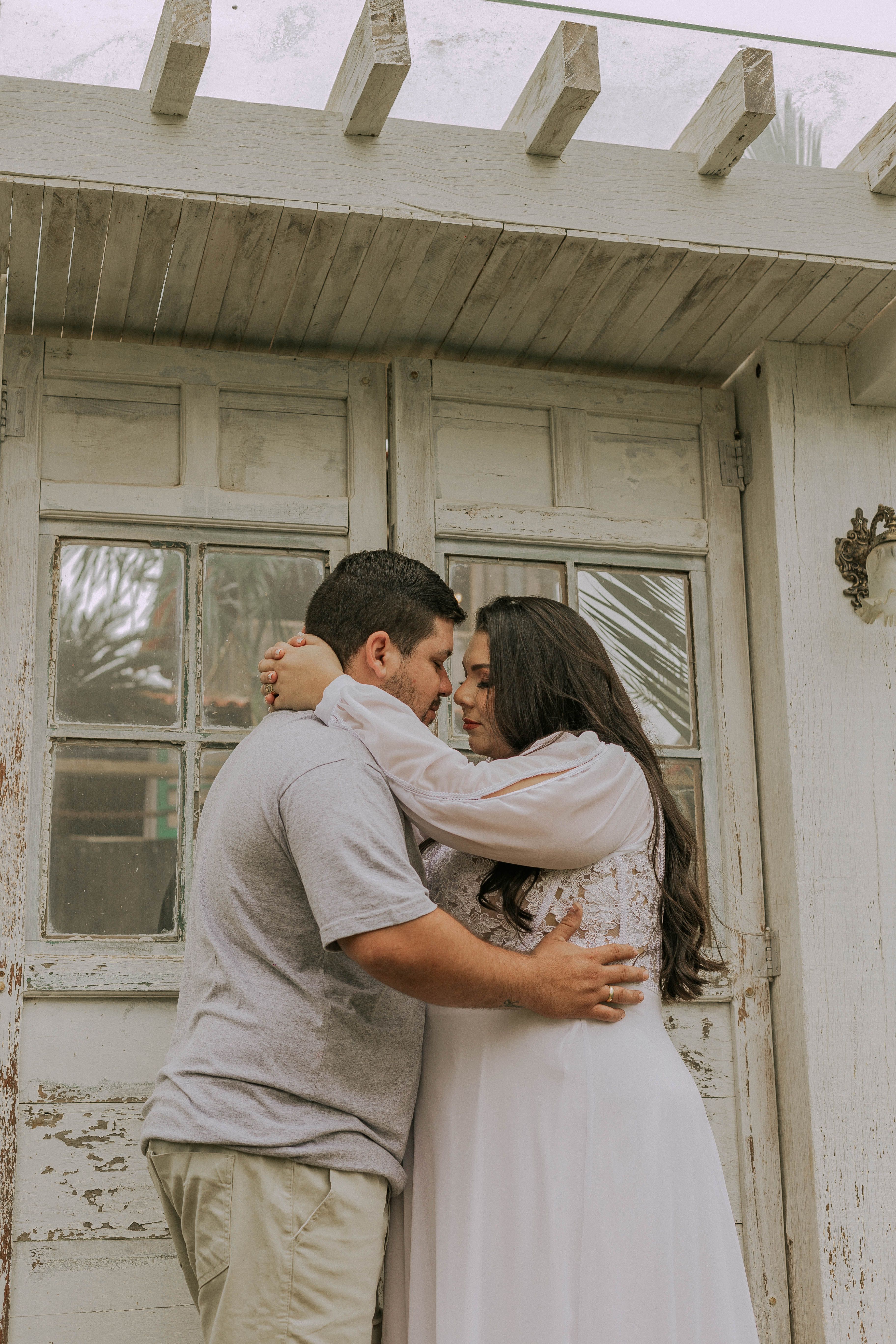 A Couple Hugging in Front of a Building · Free Stock Photo