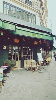 A cozy café in Paris, showcasing classic outdoor seating and urban charm.
