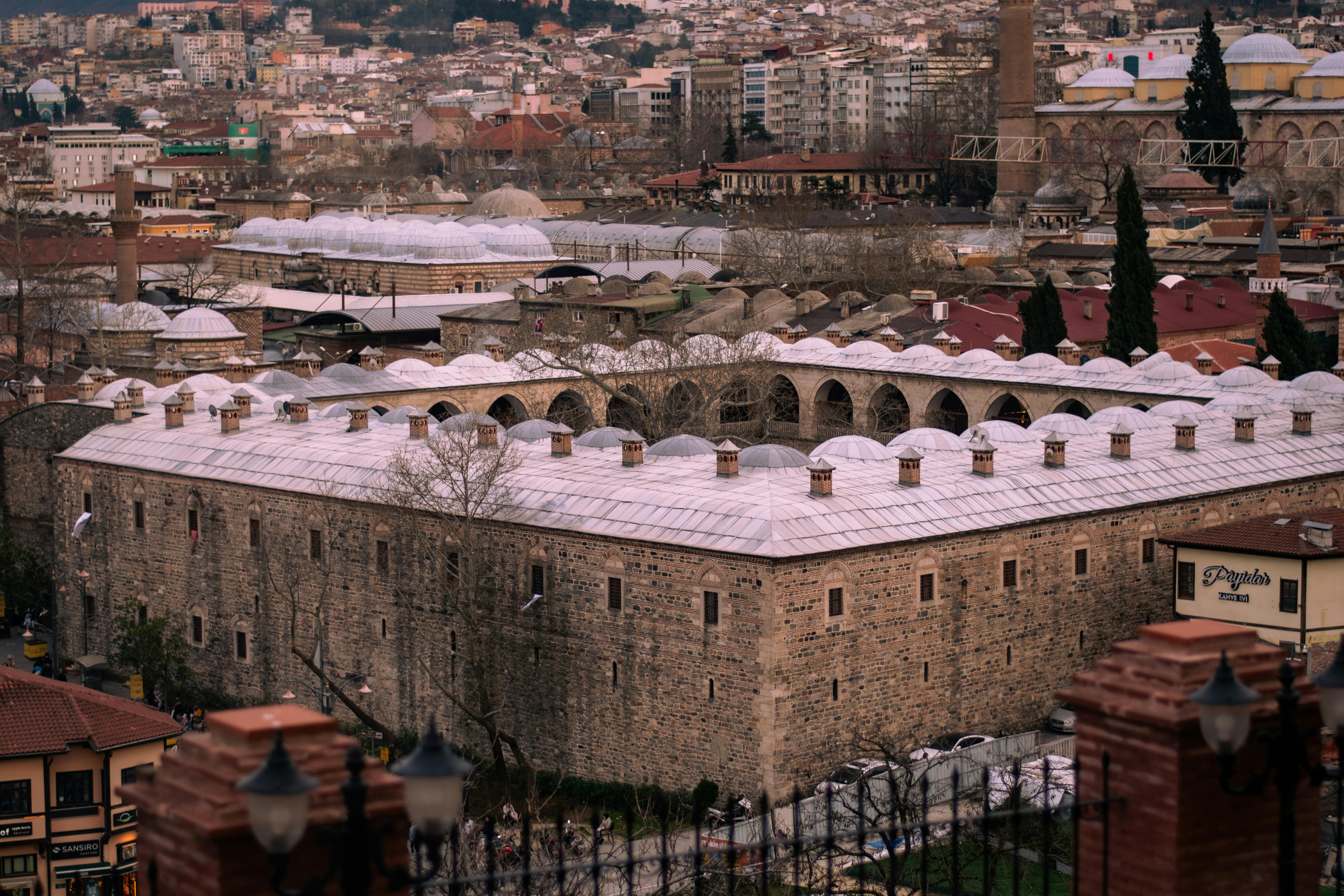 Aerial view of historic Ottoman architecture in Bursa, Türkiye, showcasing the city's unique cultural heritage.