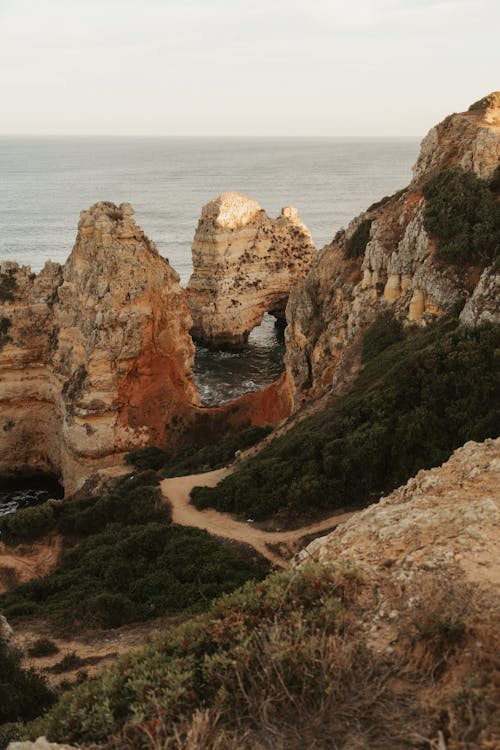 Footpath among Rock Formations on Sea Coast