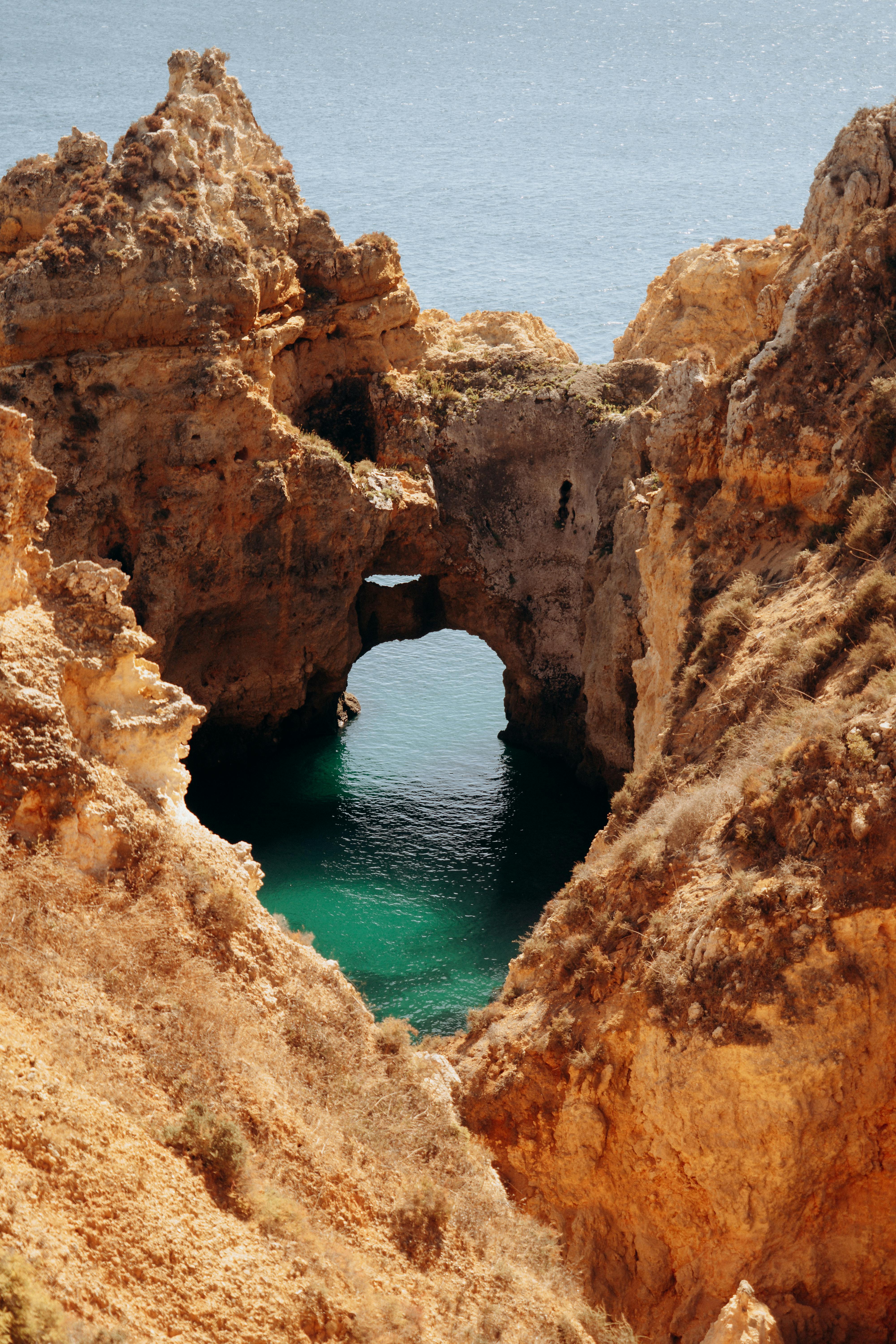Explore the breathtaking Ponta da Piedade cliffs in Lagos, Portugal, with azure ocean waters.