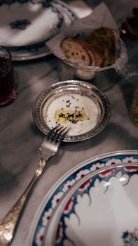A cozy table setting in İstanbul featuring bread and traditional dishes. Perfect for a cultural dining experience photo.