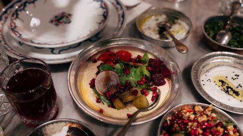 Free An assortment of traditional Turkish meze dishes featuring hummus and fresh vegetables in Istanbul, Turkey. Stock Photo