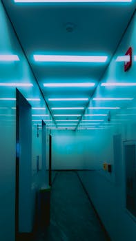 A sleek, illuminated corridor in Mexico with a modern design and blue lighting.