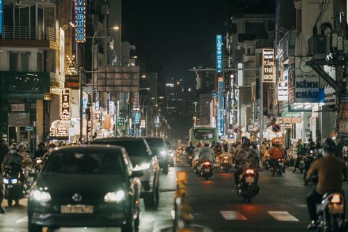 Free Bustling night scene capturing traffic and city life in Ho Chi Minh City, Vietnam. Stock Photo
