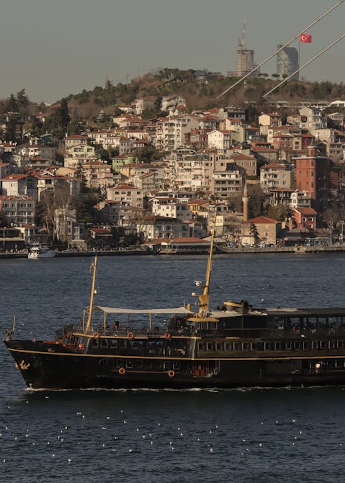 Passenger Ship Sailing on Sea Coast in City in Turkey