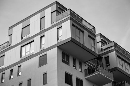 Black and white photo of a building with balconies