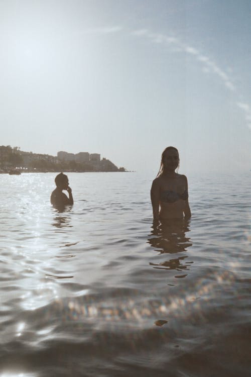 Free People Swimming in the Sea in Summer Stock Photo