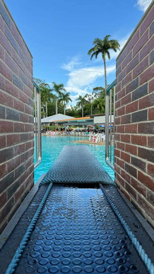 A pool with a walkway leading to it