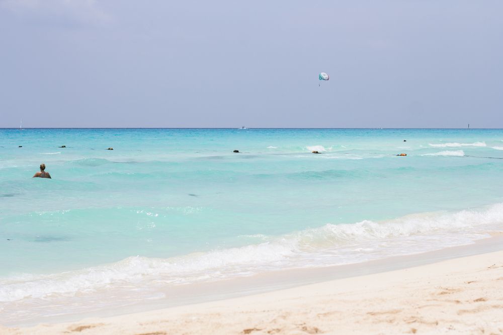 Turquoise Caribbean water with swimmers