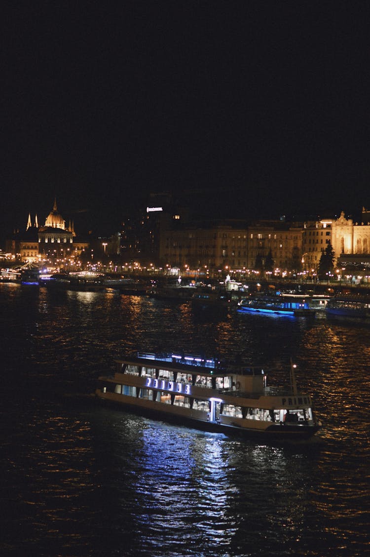 Ferry On The Danube River In Budapest At Night