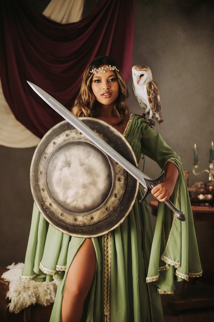 Woman Standing With Sword And Shield