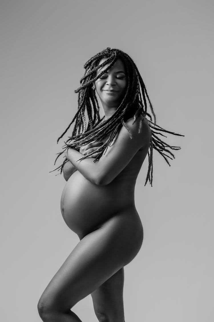 Naked Pregnant Woman With Dreadlocks