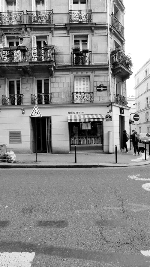 A black and white photo of a street corner