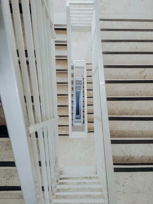 Free Top-down view of a modern staircase with repeating patterns in Amman, Jordan. Stock Photo
