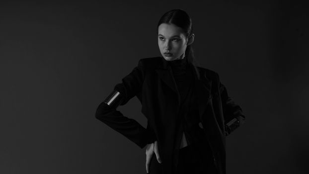 Woman Standing with Hands on Hips in Black and White
