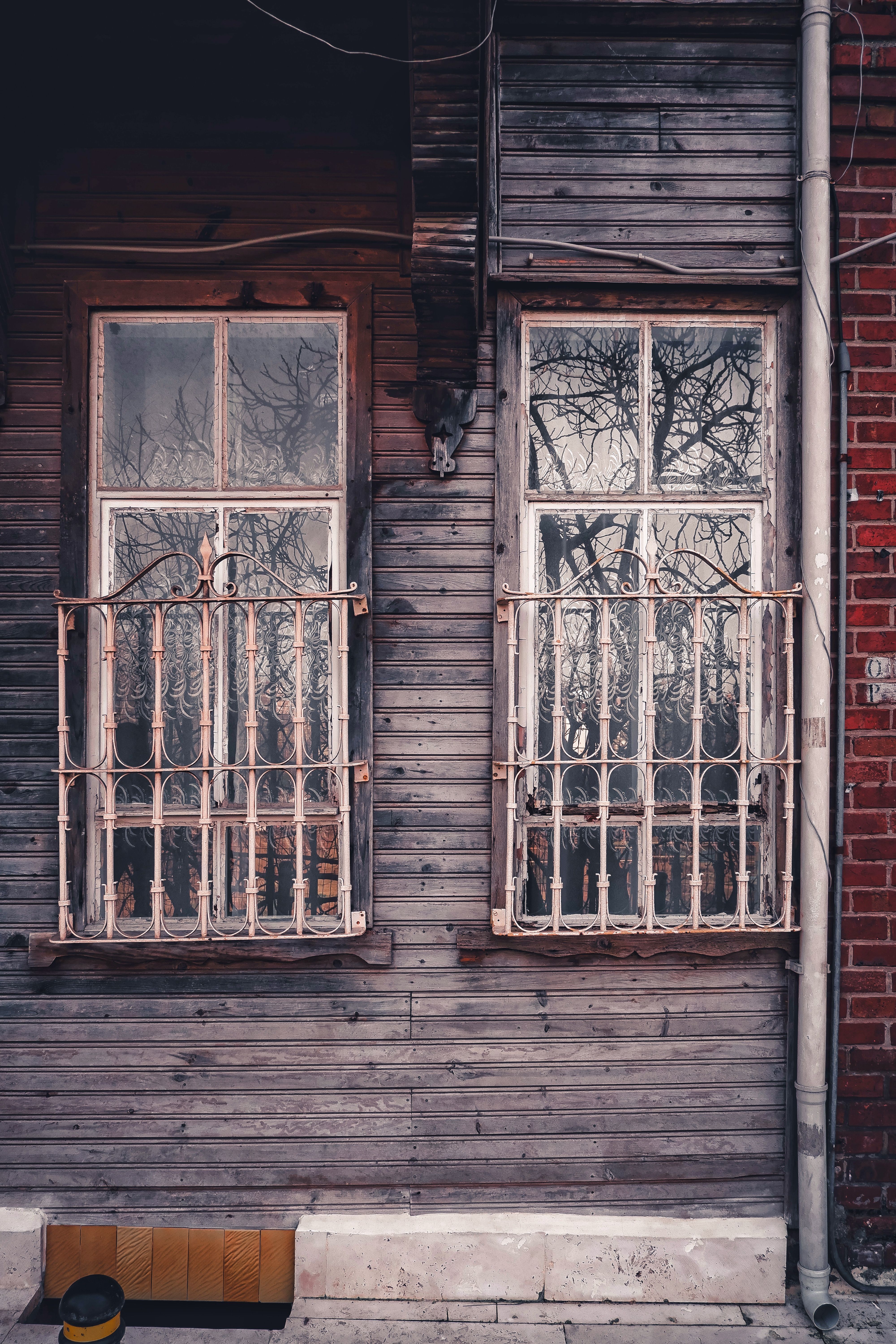 Wooden Facade with Barred Windows · Free Stock Photo