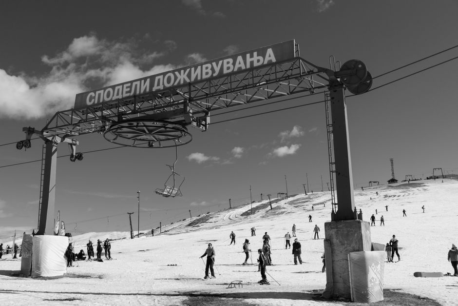 Skiers and snowboarders enjoying a winter day on the slopes in Mavrovo, North Macedonia.