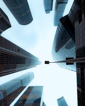 Modern skyscrapers against a clear sky, illustrating urban architecture.