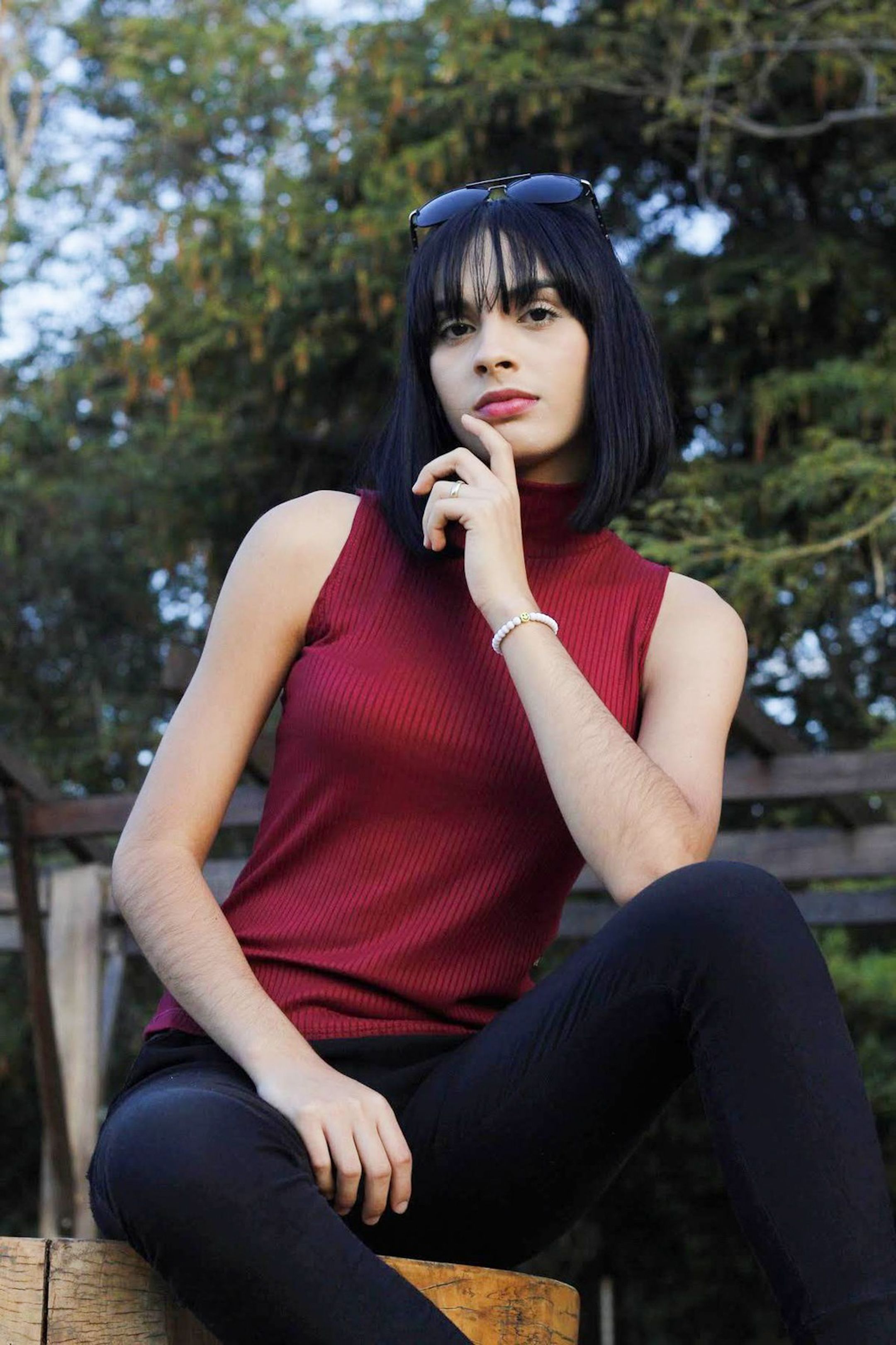 Portrait of a Woman Sitting Outdoors · Free Stock Photo