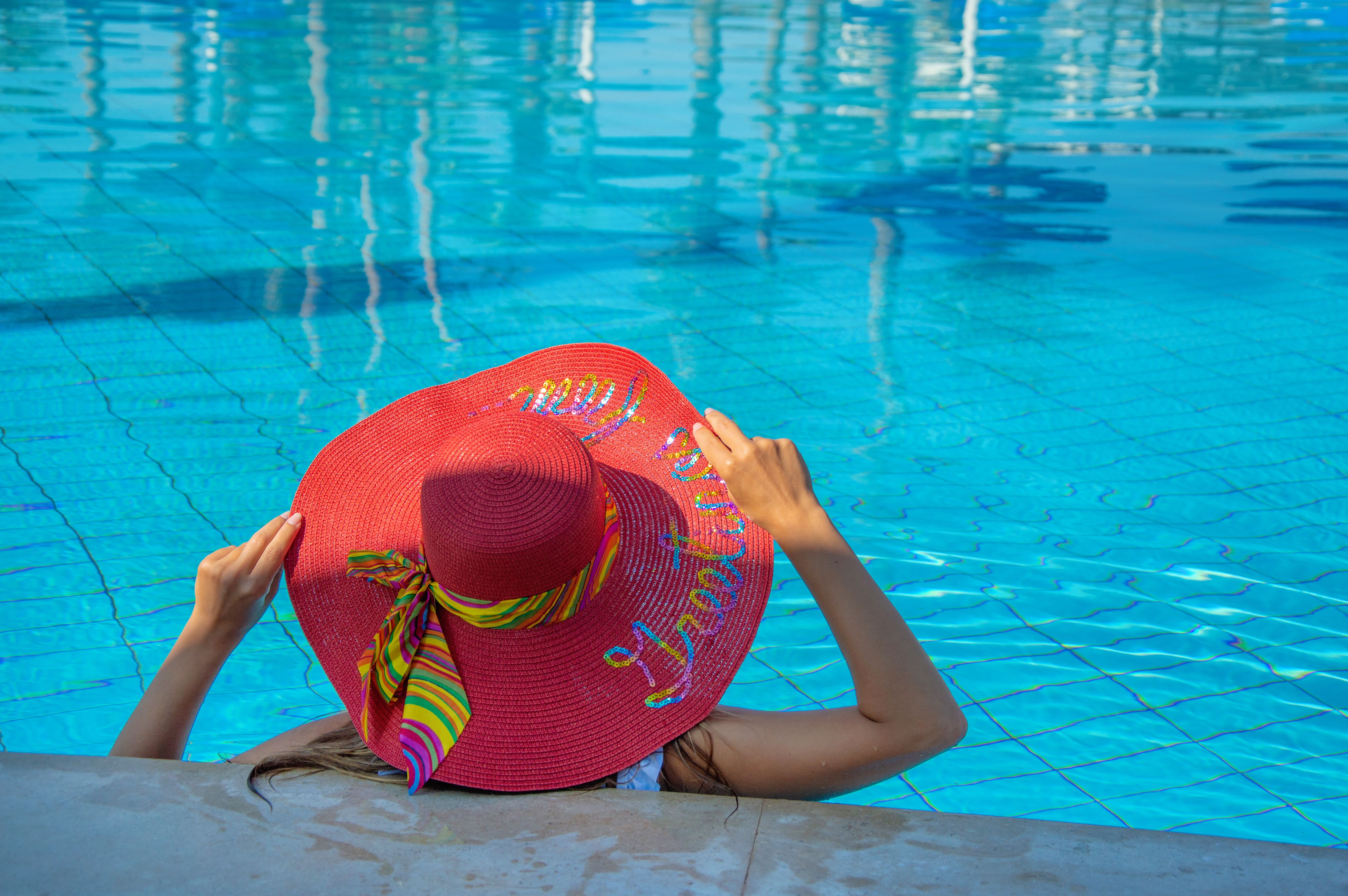 Tourist Woman in Big Red Sun Hat Relaxing in the Swimming Pool · Free ...
