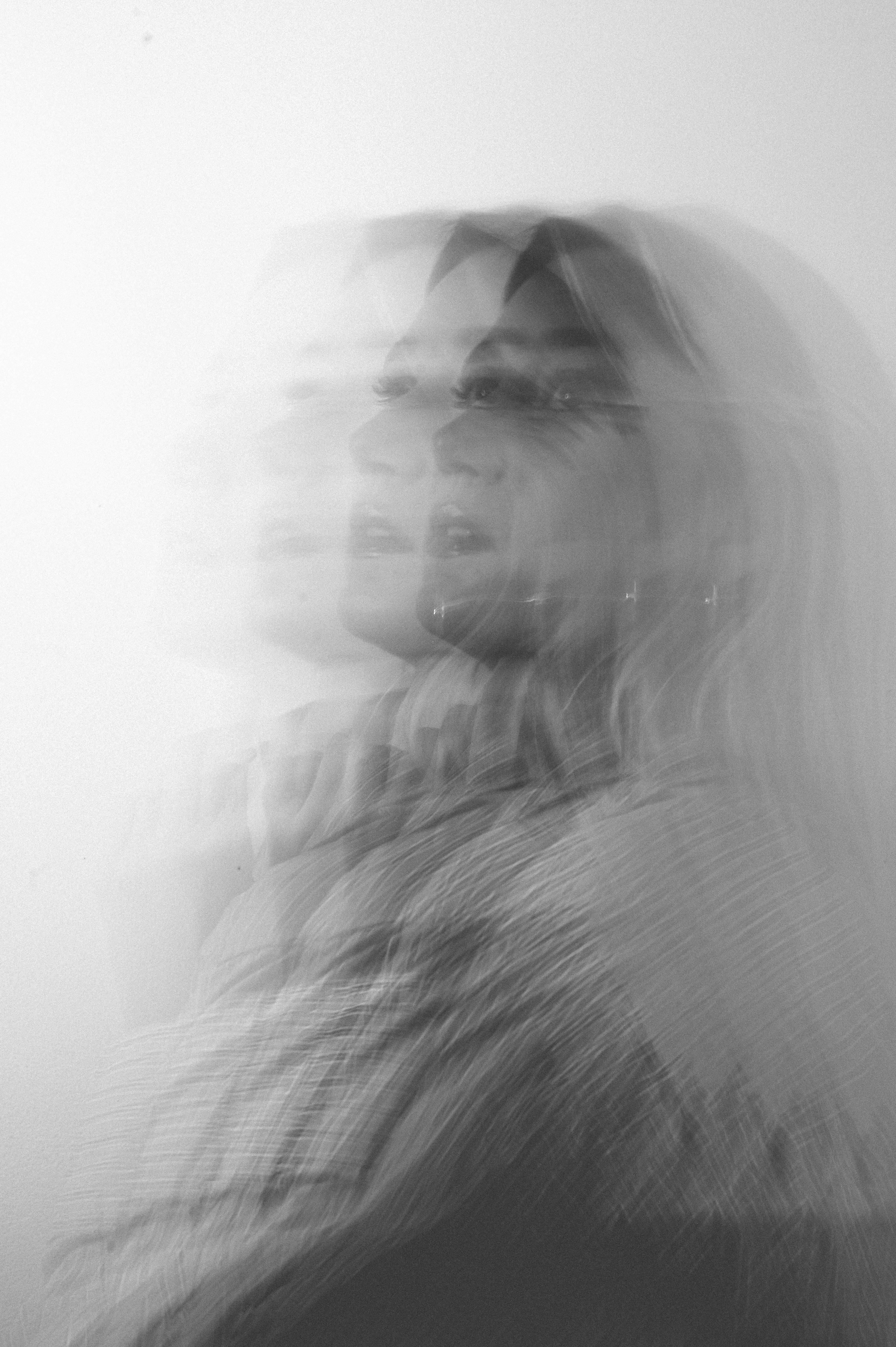 Black and white conceptual portrait with multiple exposure effect.