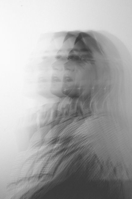 Black and white conceptual portrait with multiple exposure effect.
