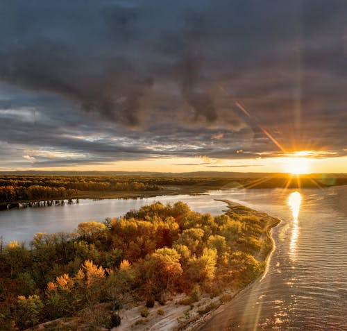 Photos gratuites de coucher de soleil, fleuve, lever de soleil