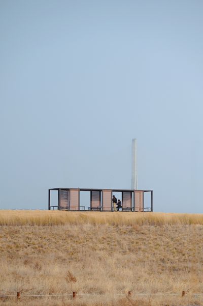 A small modern structure alone in an open field — photo by Junsu Park on Pexels