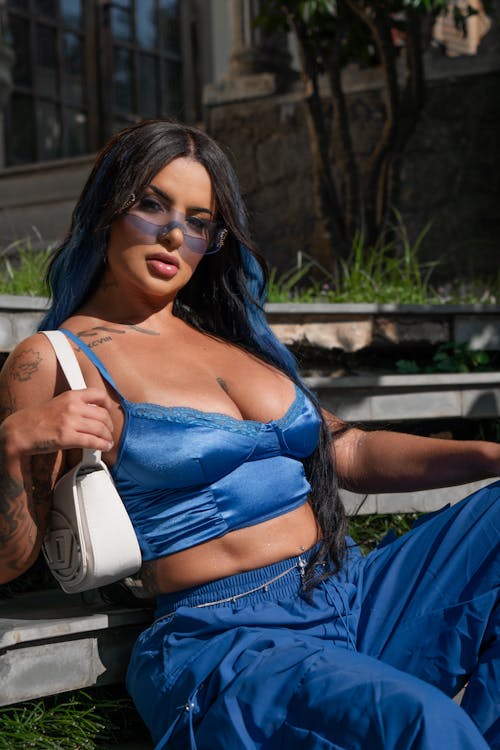 Woman Wearing a Blue Bra, Posing on a Bench