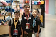 Boys with Identification Cards, Posing in a Store
