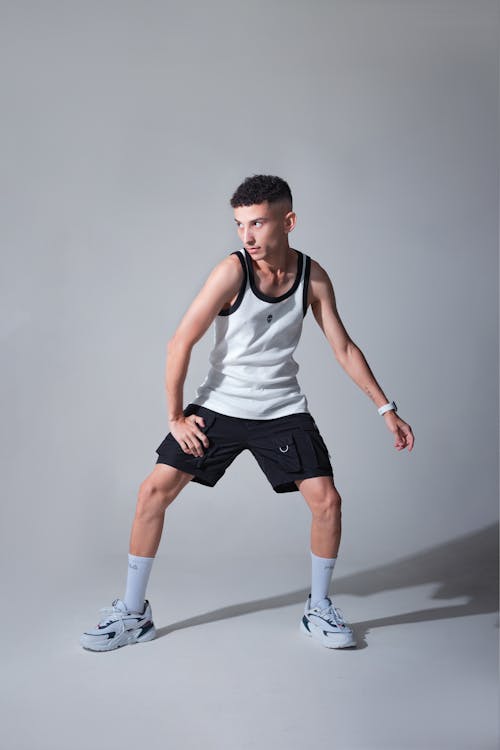 Man in Tank Top and Shorts