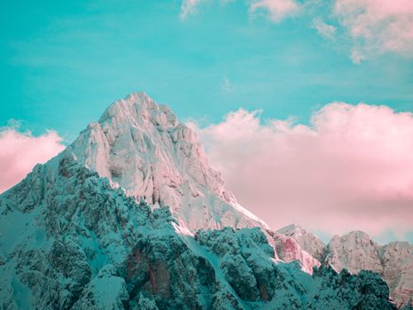 A breathtaking view of a snow-capped mountain under a vibrant sky in Kranjska Gora, Slovenia.