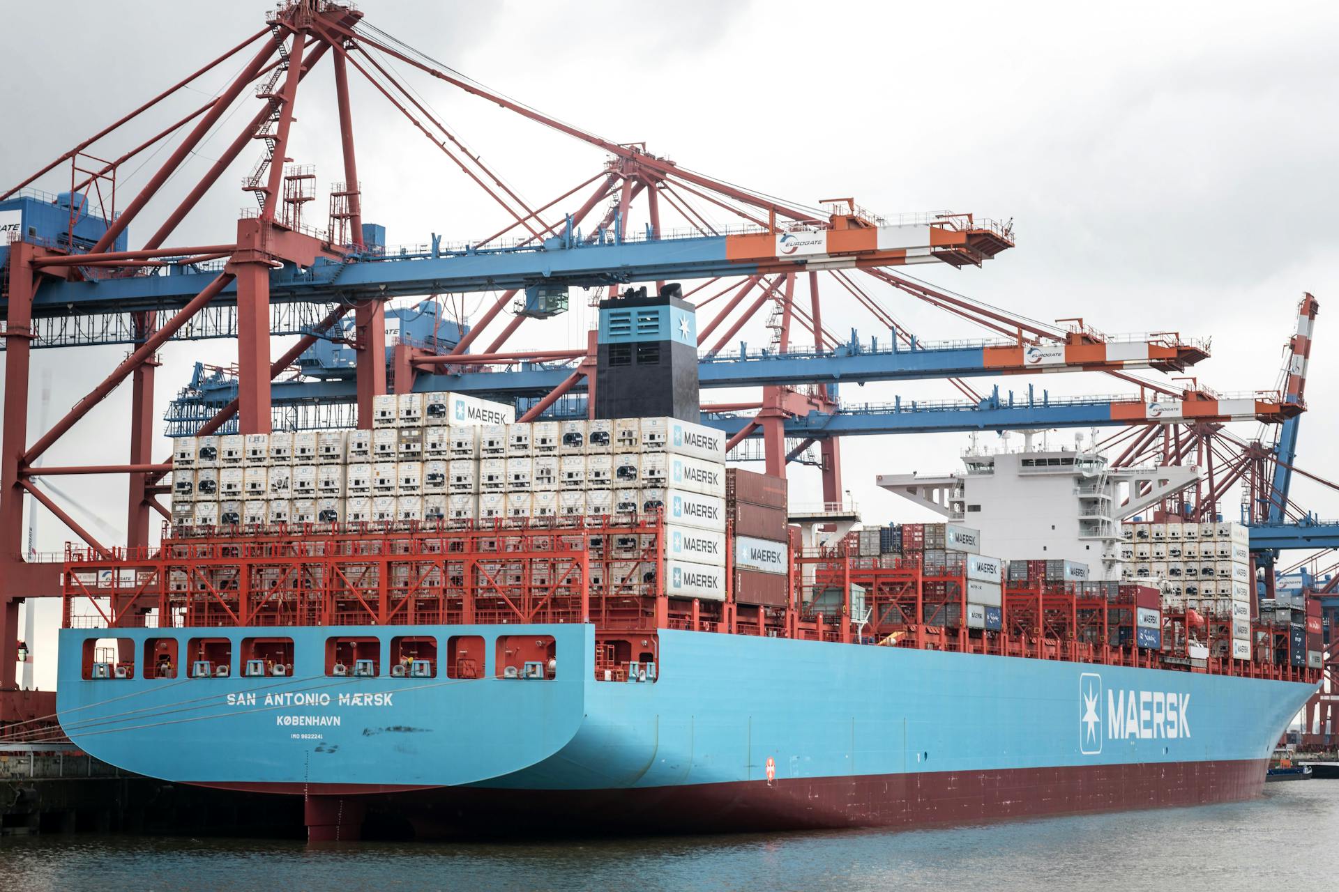 Container ship docked at the Port of Hamburg, showcasing industrial logistics.