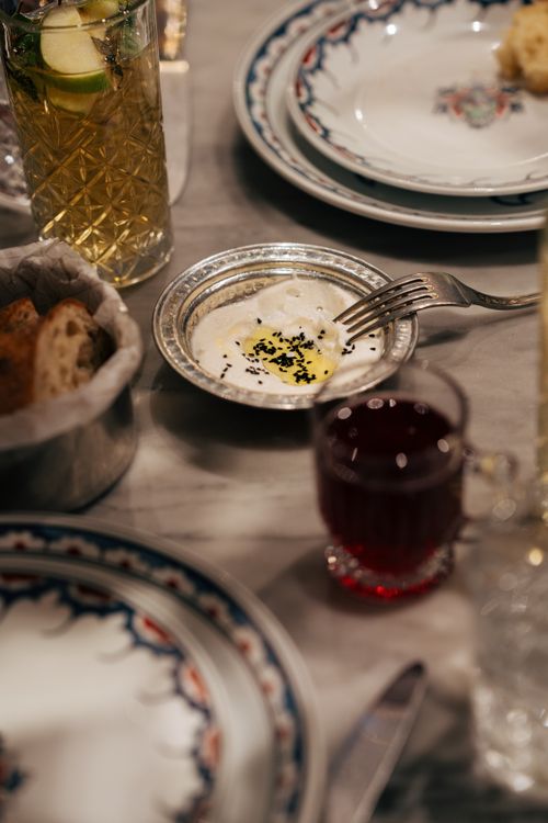 Free Close-up of a beautifully set dinner table with drinks and appetizers ready to be served. Stock Photo